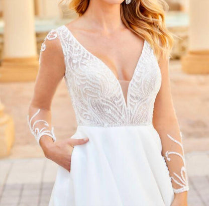 Sheer Sleeve Plunging Neckline Wedding Dress