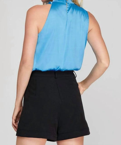AMERICAN FIT - Clare Mock Nek Sleeveless Asymmetrical Woven Top - Rack Hunt