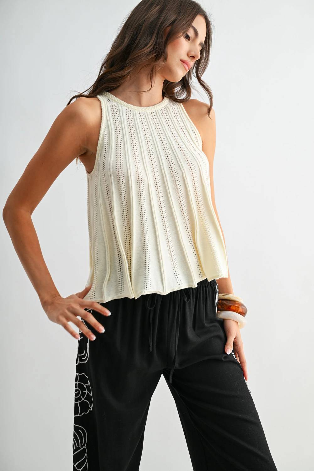 Sleeveless Knit Top With Flared Hem