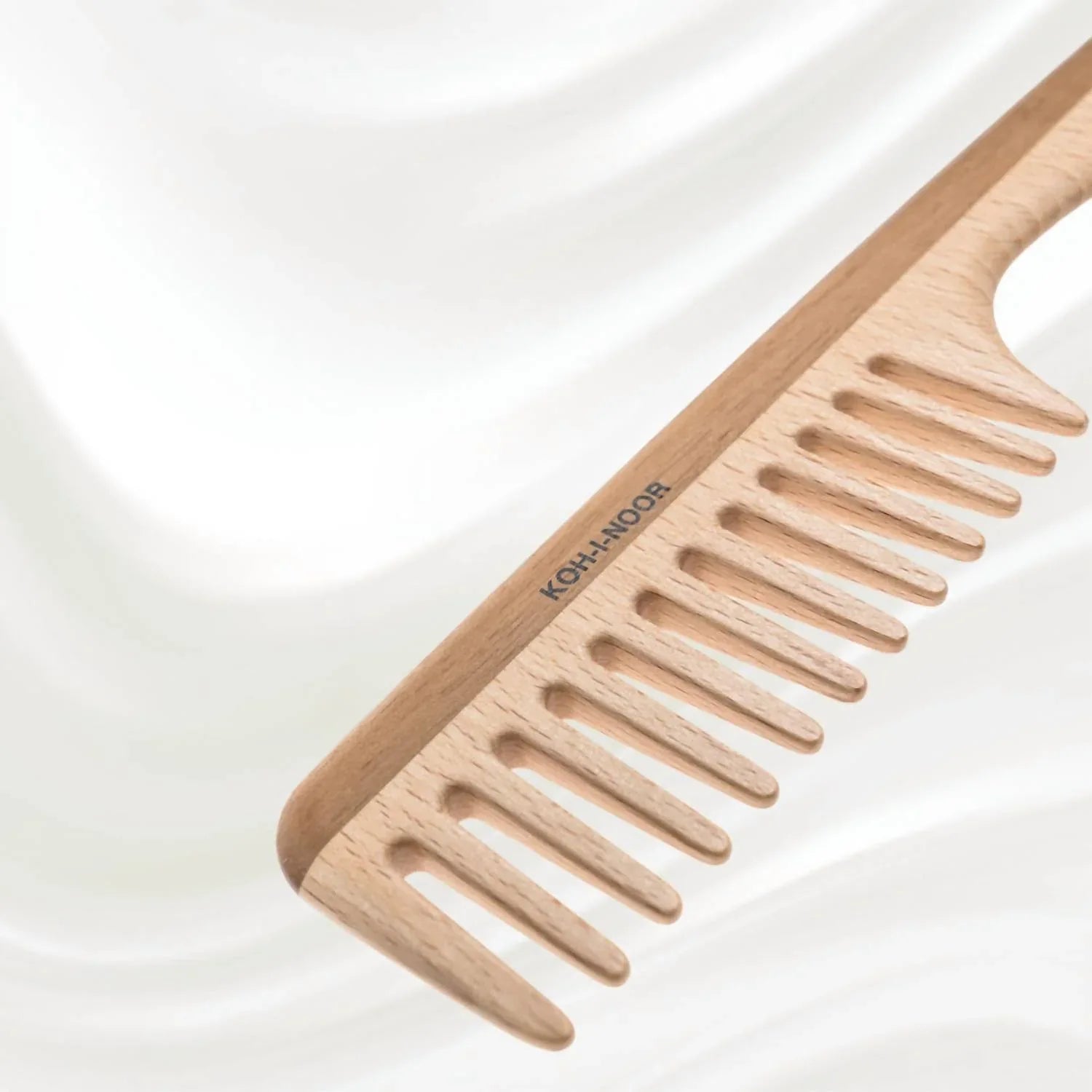 Koh-I-Noor Beauty USA - Women's Legno Beech And Kotibe Wood Wide Tooth Comb - lifestyle view - Rack Hunt