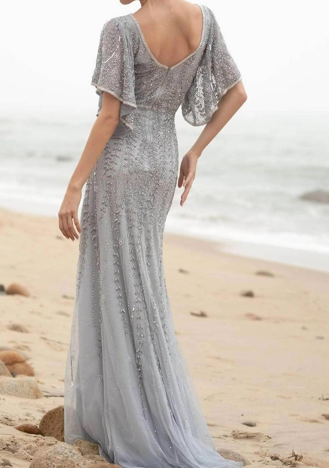 Trailing Beaded Evening Gown