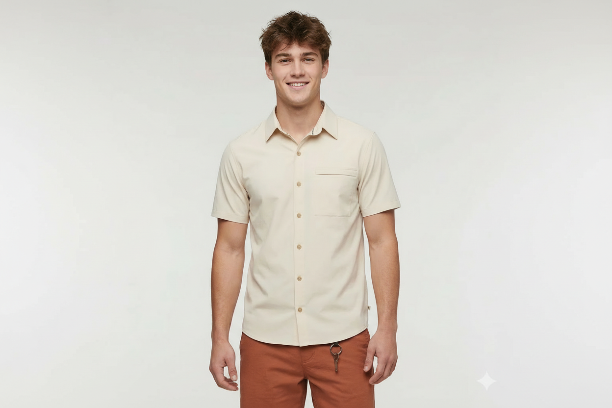 Man wearing a beige short-sleeve shirt and brown pants on a white background